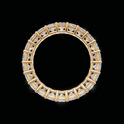 A gold eternity ring featuring a continuous row of clear gemstones in a geometric setting, presented on a solid black background.
