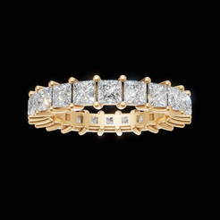 A yellow gold eternity ring featuring a row of princess-cut diamonds, presented on a solid black background.