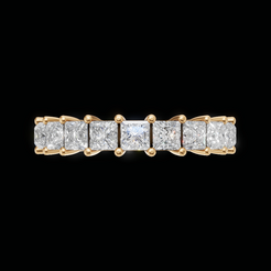 A yellow gold eternity ring featuring a row of princess-cut diamonds set in a five-stone band, shown against a solid black background.