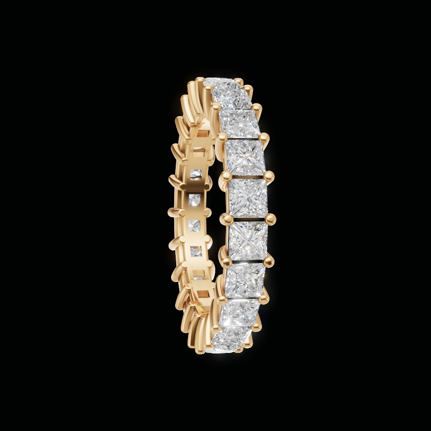 A yellow gold eternity ring featuring a continuous row of round brilliant-cut diamonds on a solid black background.