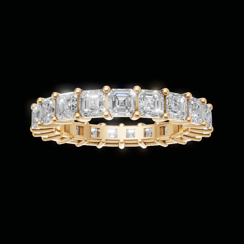 A yellow gold eternity ring featuring a row of baguette-cut clear gemstones, shown against a solid black background.