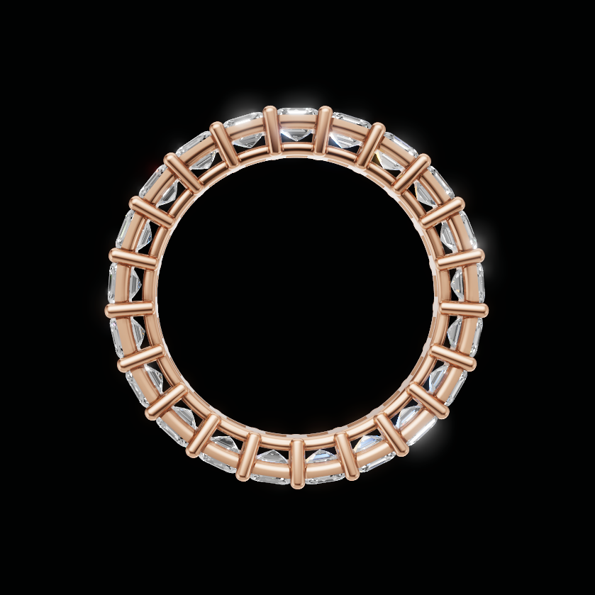 A gold circular ring with a halo of clear rectangular gemstones, shown against a solid black background.