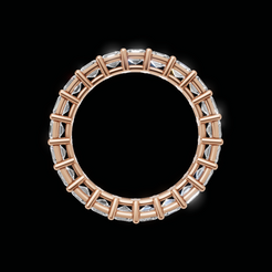 A gold circular ring with a halo of clear rectangular gemstones, shown against a solid black background.