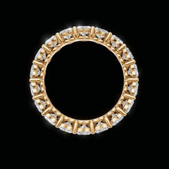 A gold eternity ring set with clear diamonds, shown against a solid black background.