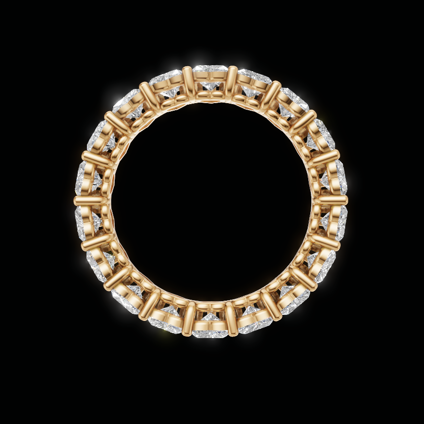 A gold eternity ring set with clear diamonds, shown against a solid black background.