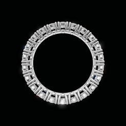 A silver-toned circular ring featuring a continuous border of square-cut clear gemstones, presented on a solid black background.