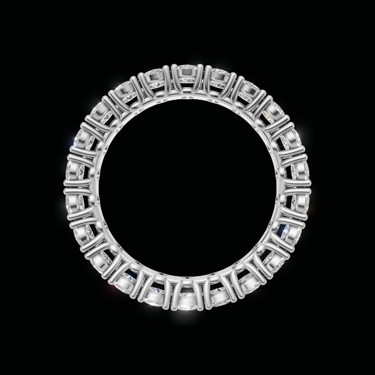 A silver-toned circular ring featuring a continuous border of square-cut clear gemstones, presented on a solid black background.
